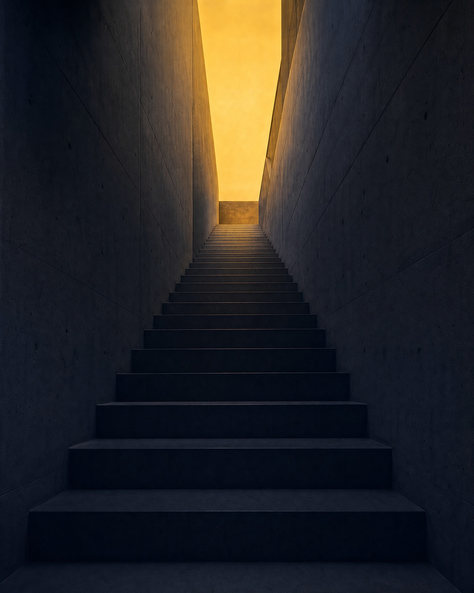 A narrow stairwell rising toward warm golden light at the top